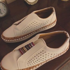 Size 9 shoes. Slightly wider than 9m.  White, never worn.  Slip on.